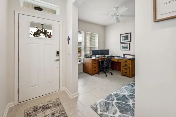a workspace with furniture and a chandelier