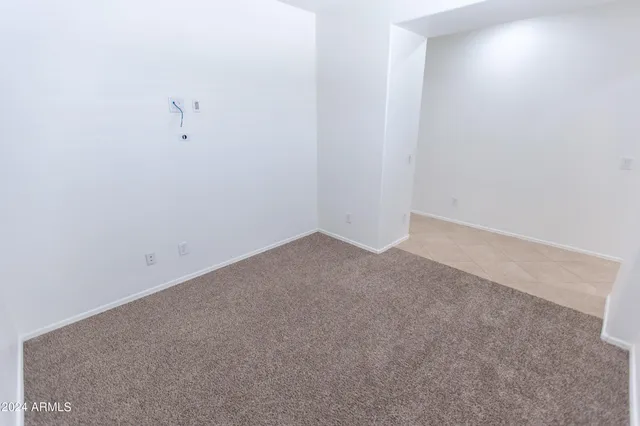 a kitchen with stainless steel appliances granite countertop a sink a refrigerator and a stove