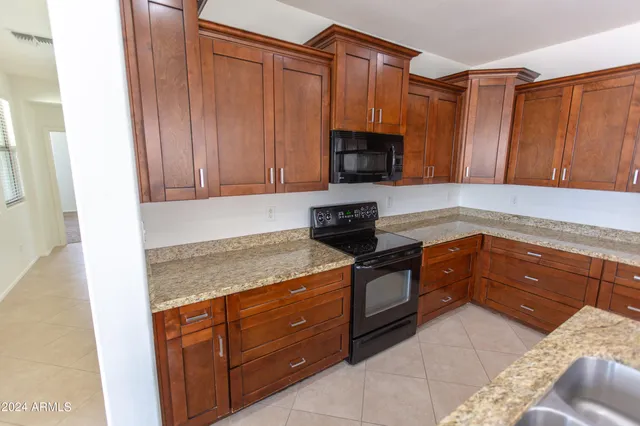 a view of cabinets with refrigerator and cabinet