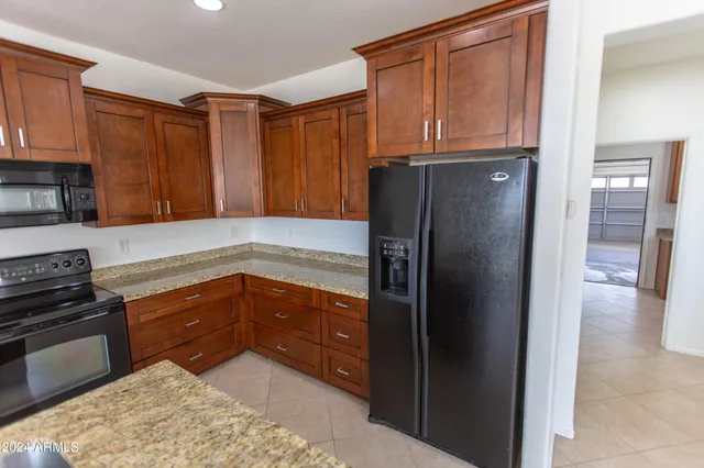 a kitchen with a sink a counter space and a window