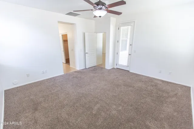 a bathroom with a granite countertop sink a vanity and a mirror