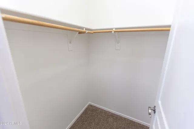 a room with a sink and a mirror