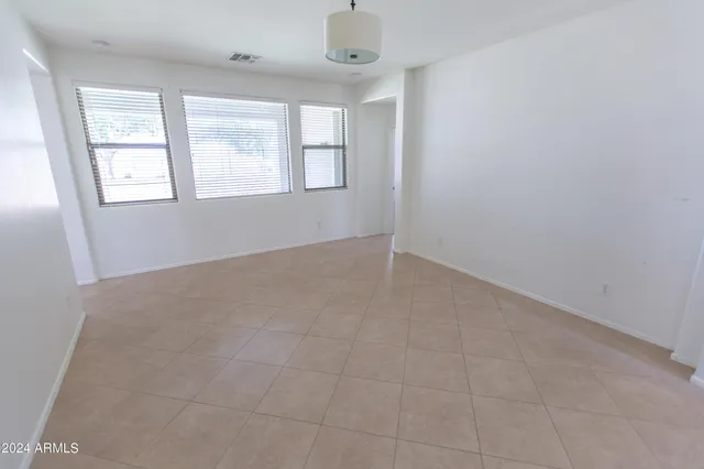 a view of empty room with windows