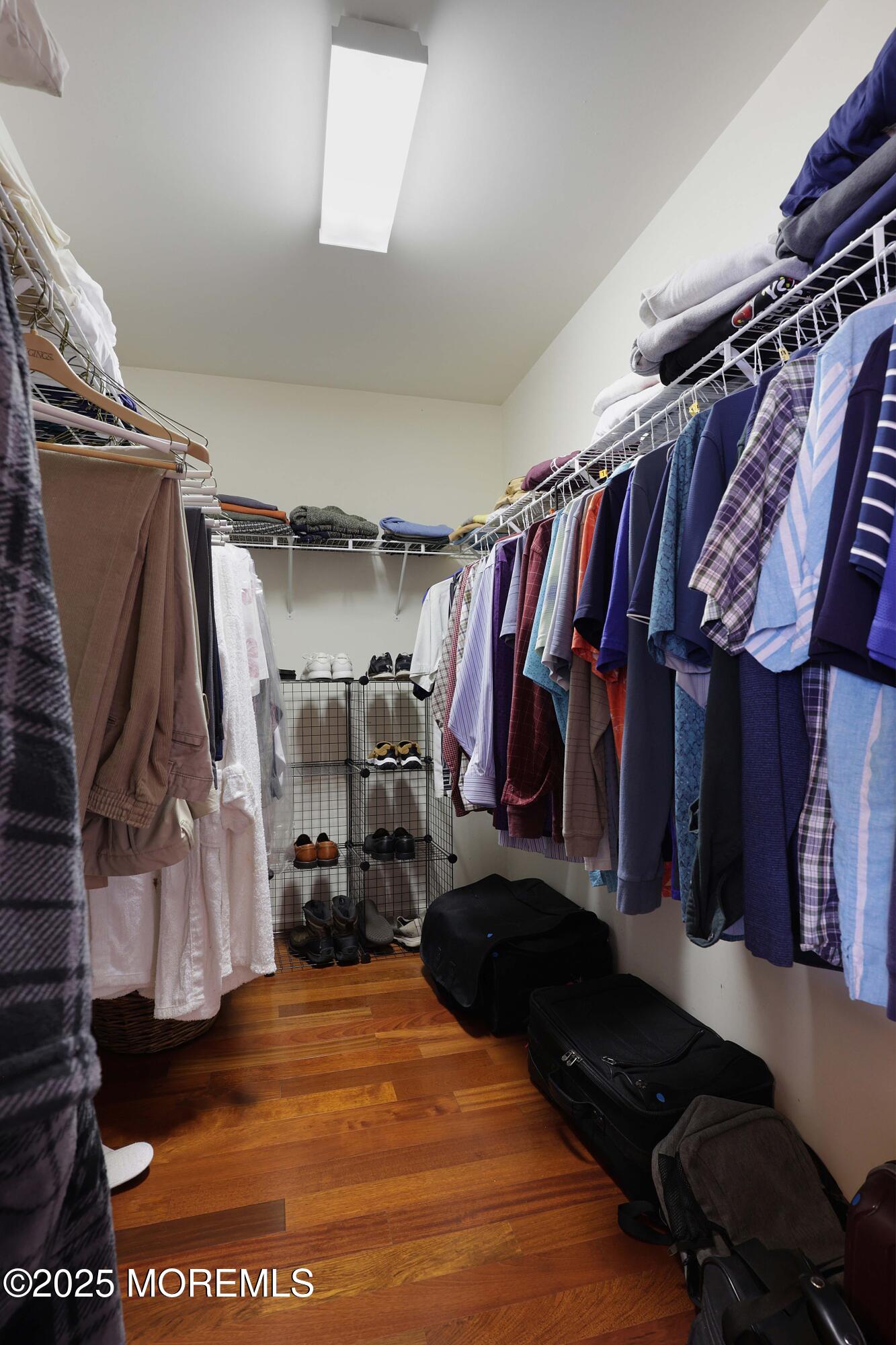 39 Dowing Lane Jackson, NJ 08527 - Photo 18 of 34 a view of walk in closet with clothes and shoes