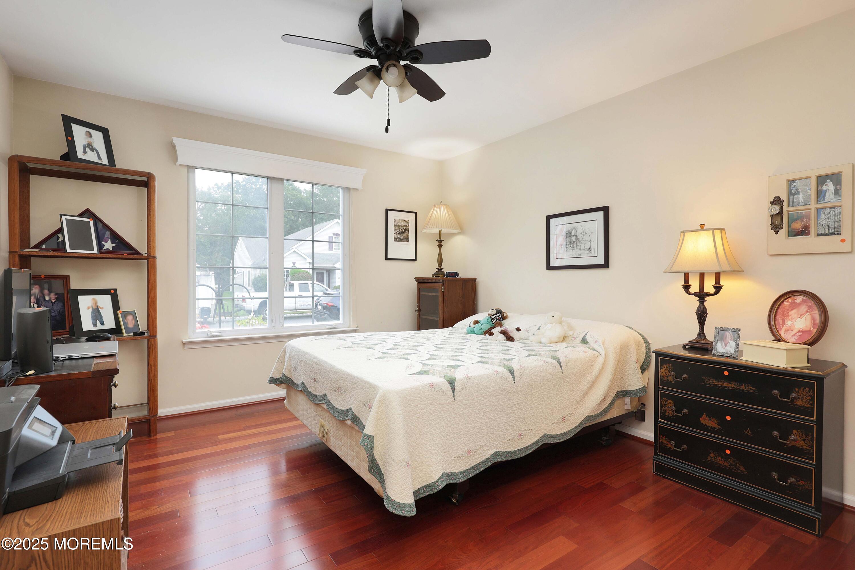 39 Dowing Lane Jackson, NJ 08527 - Photo 21 of 34 a bedroom with a bed and wooden floor