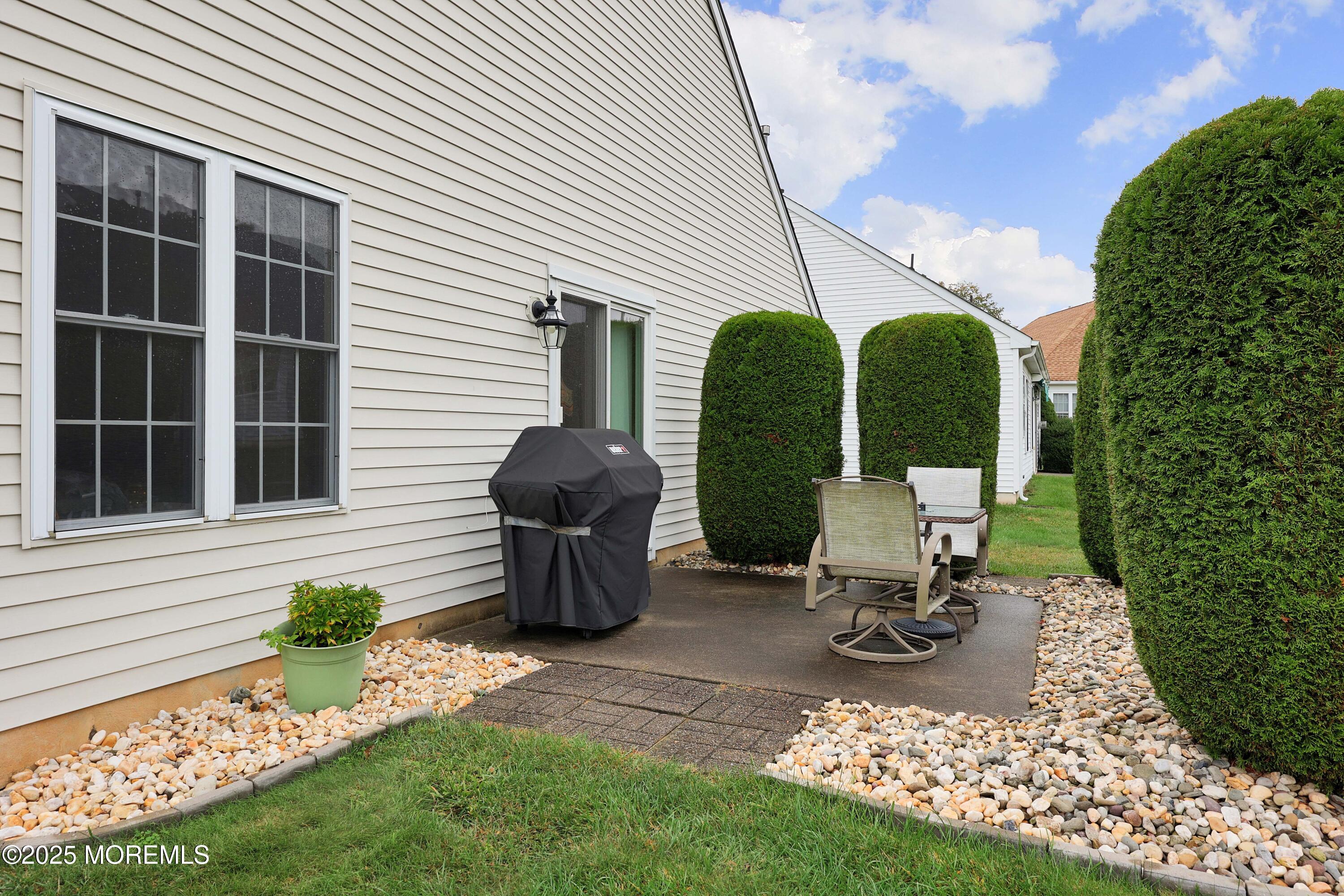 39 Dowing Lane Jackson, NJ 08527 - Photo 29 of 34 a view of a house with backyard and sitting area