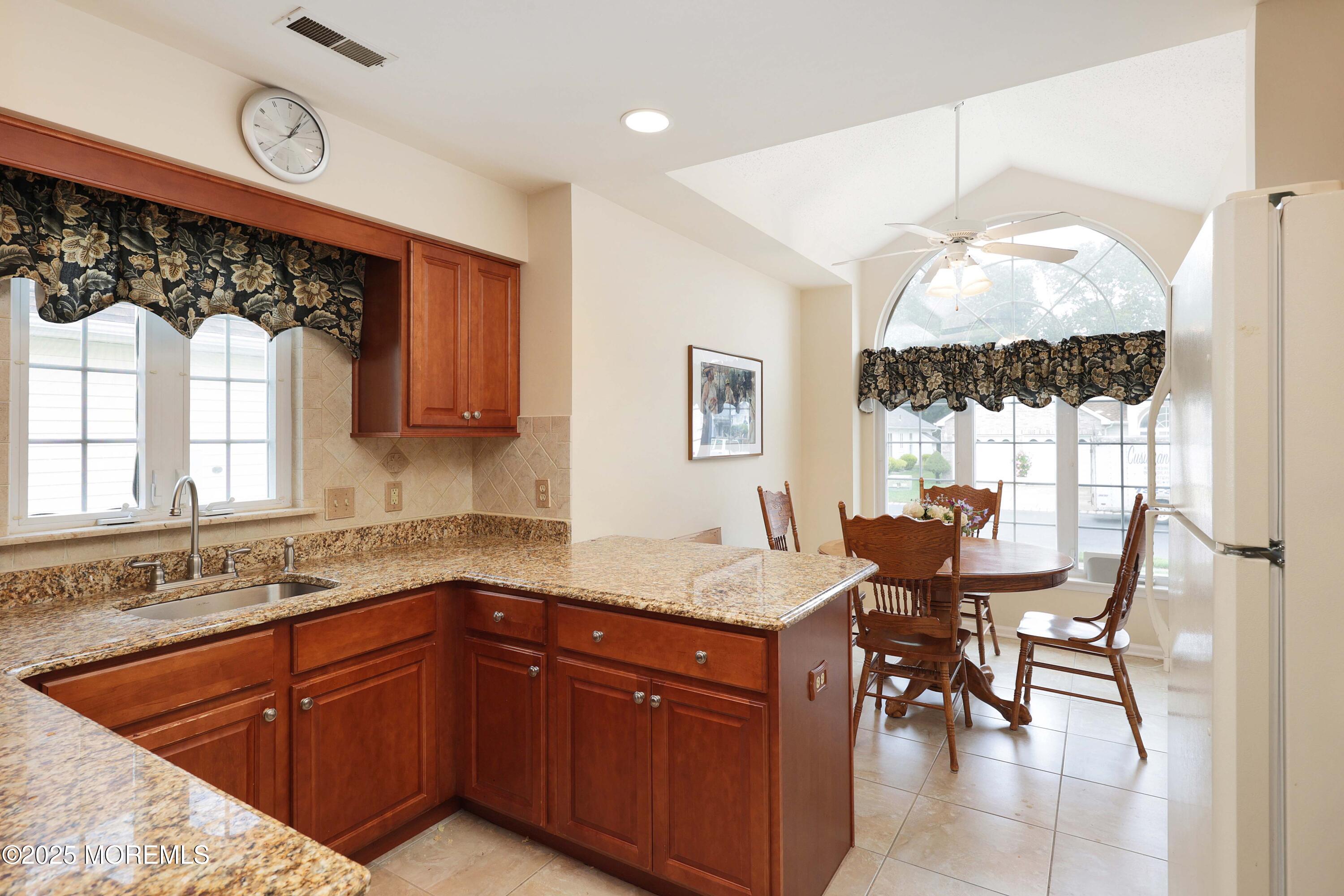 39 Dowing Lane Jackson, NJ 08527 - Photo 10 of 34 a kitchen with a sink and a stove top oven