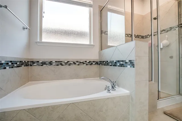 a bath tub sitting next to a window