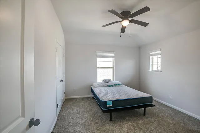 a room with window and ceiling fan