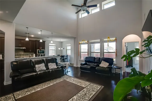 a living room with furniture and a potted plant