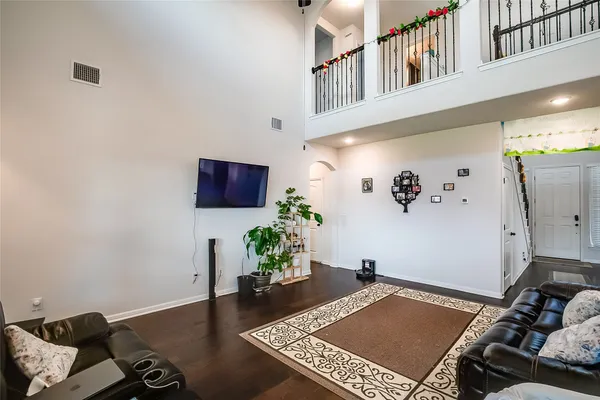 a living room with furniture rug and a window