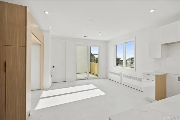 a spacious bathroom with a tub and mirror