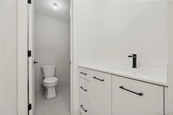 a bathroom with a toilet and a sink