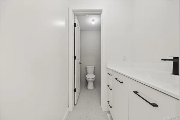 a bathroom with a granite countertop sink