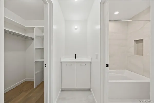 a bathroom with a shower and a tub