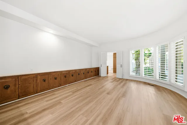 a kitchen with stainless steel appliances a sink stove and cabinets