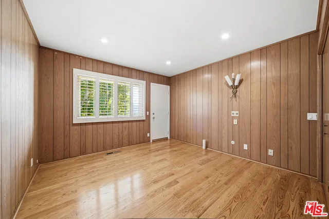 a view of a swimming pool with a yard