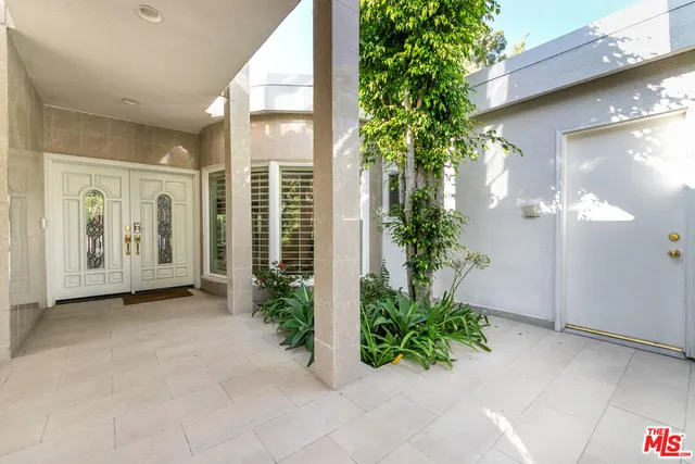 a view of kitchen with sink and window