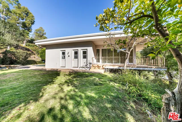 a view of empty room with wooden ceiling