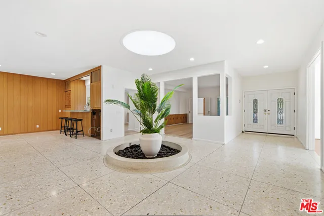 a view of kitchen with sink and a refrigerator