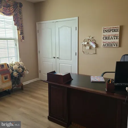 a view of workspace with wooden floor