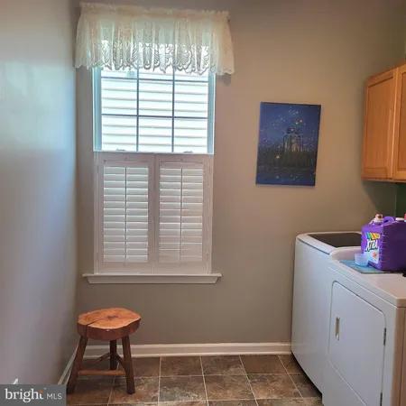 a view of an empty room with stairs
