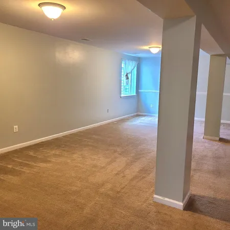 a view of a room with wooden walls