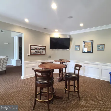 a kitchen with granite countertop wooden cabinets a sink and dishwasher
