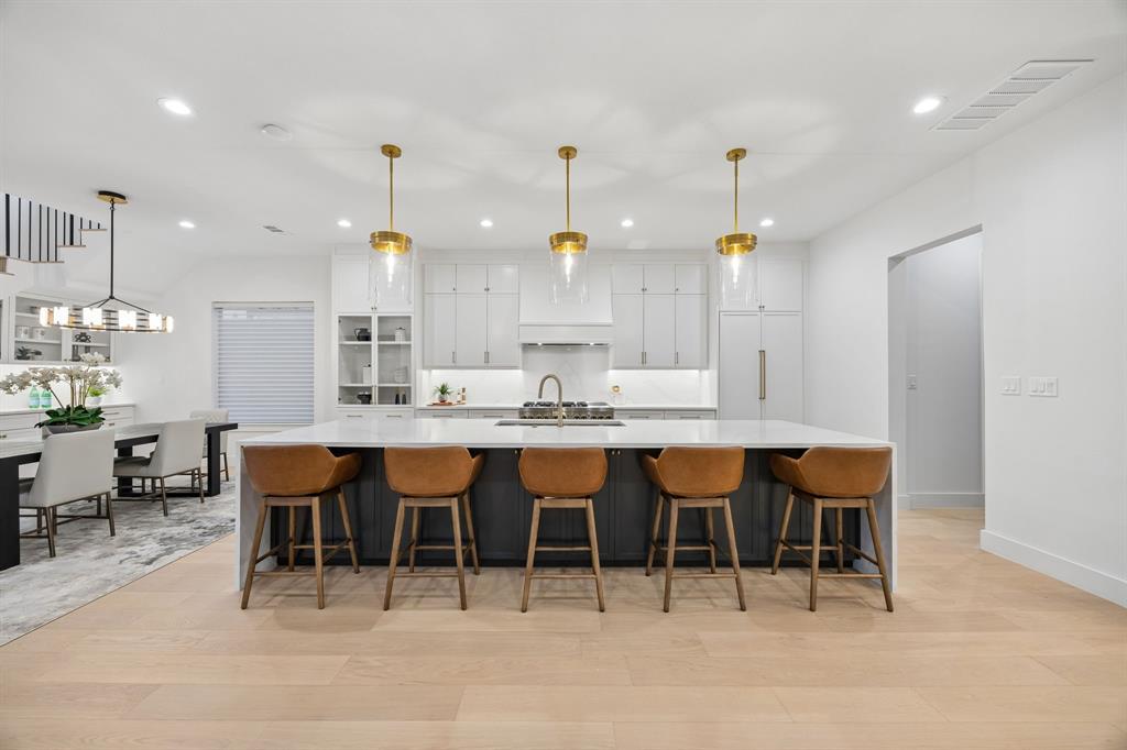 4311 Merrell Road Dallas, TX 75229 - Photo 2 of 30 a large kitchen with a table and chairs