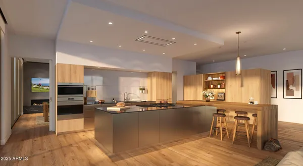 a kitchen with stainless steel appliances granite countertop a refrigerator and a sink