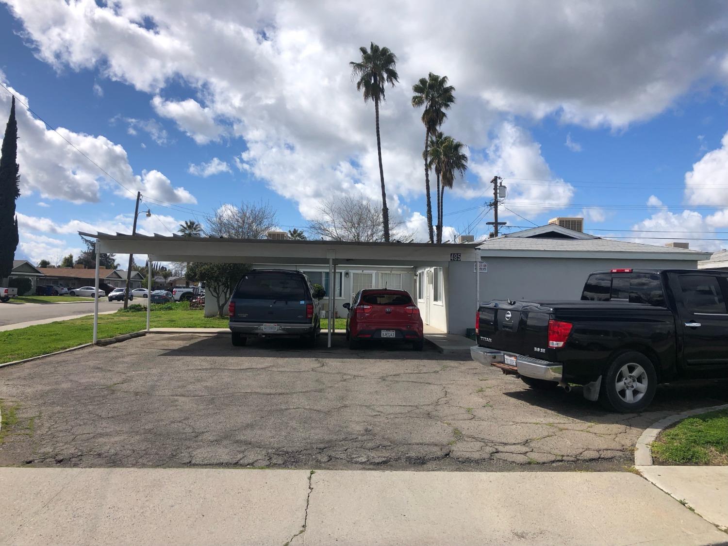 320 Brooks & Beech Lemoore Ca Lemoore, CA 93245 - Photo 4 of 21 a view of a car in the back yard