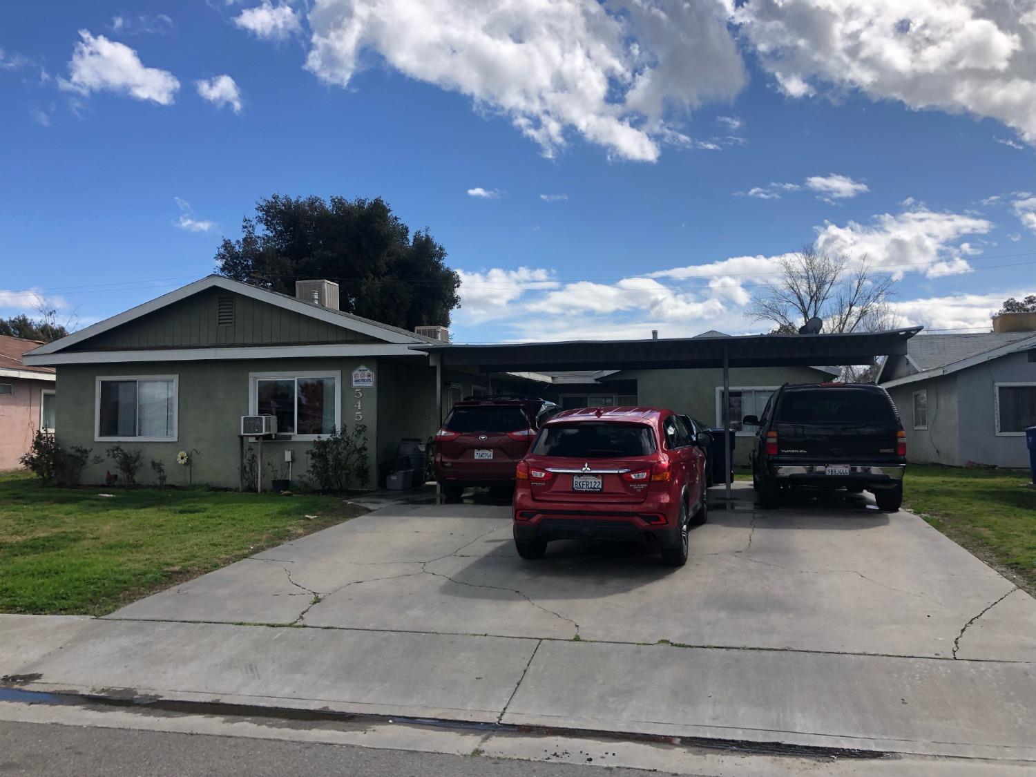 320 Brooks & Beech Lemoore Ca Lemoore, CA 93245 - Photo 9 of 21 a car parked in front of a house