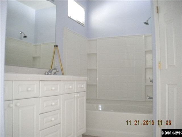 1764 Trek Trail Reno, NV 89521 - Photo 8 of 11 a bathroom with a sink and vanity