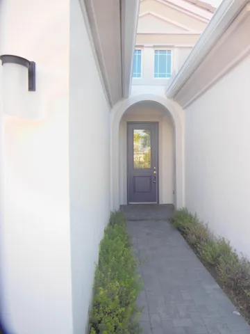 a view of a hallway with entryway of a house