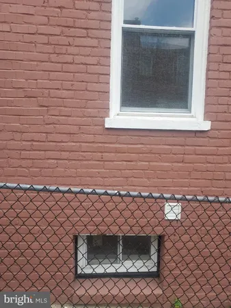 a view of a brick building with many windows