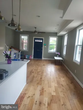 a view of a livingroom with furniture and windows