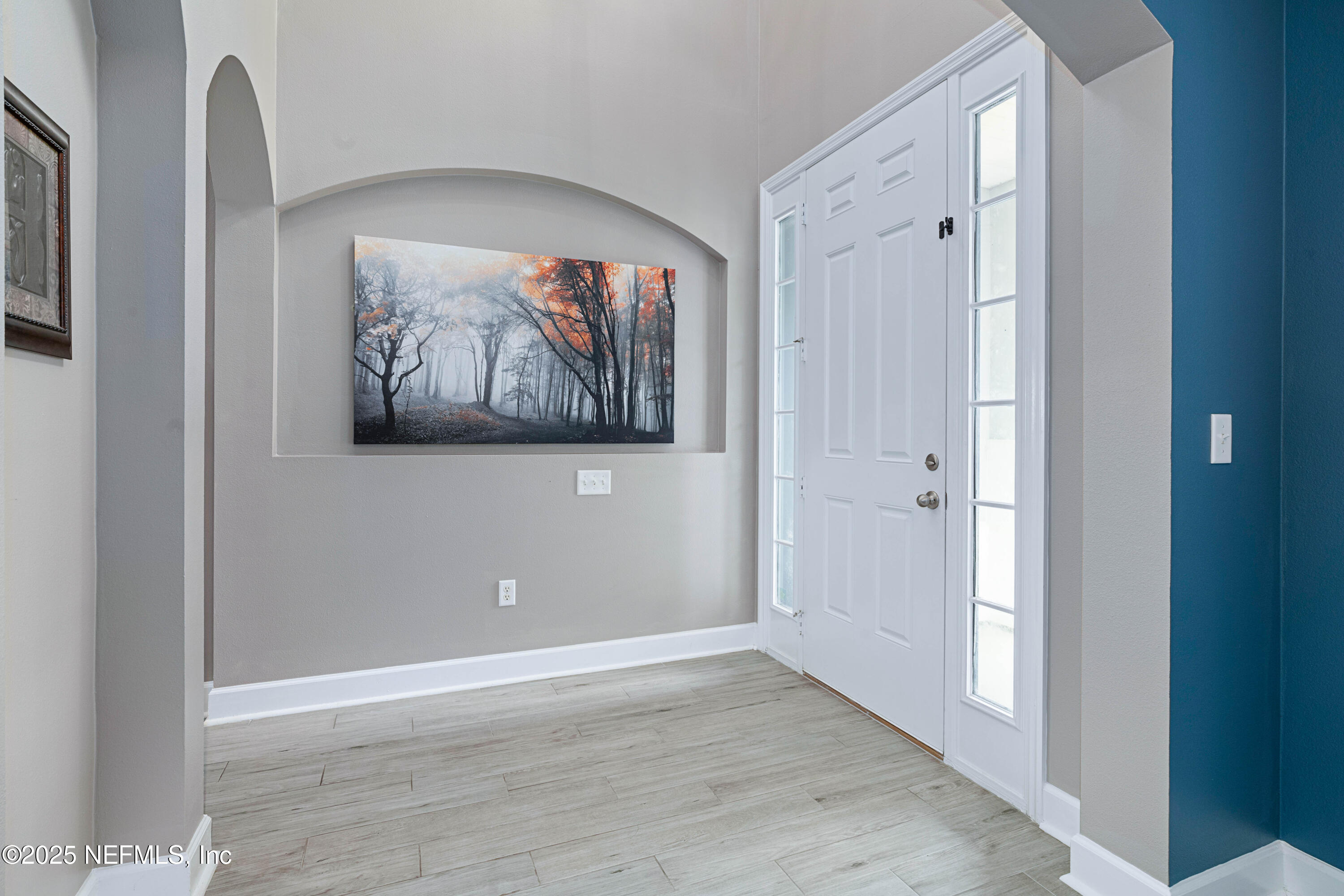 201 North Saxxon Road St. Augustine, FL 32092 - Photo 3 of 42 a view of an empty room with wooden floor