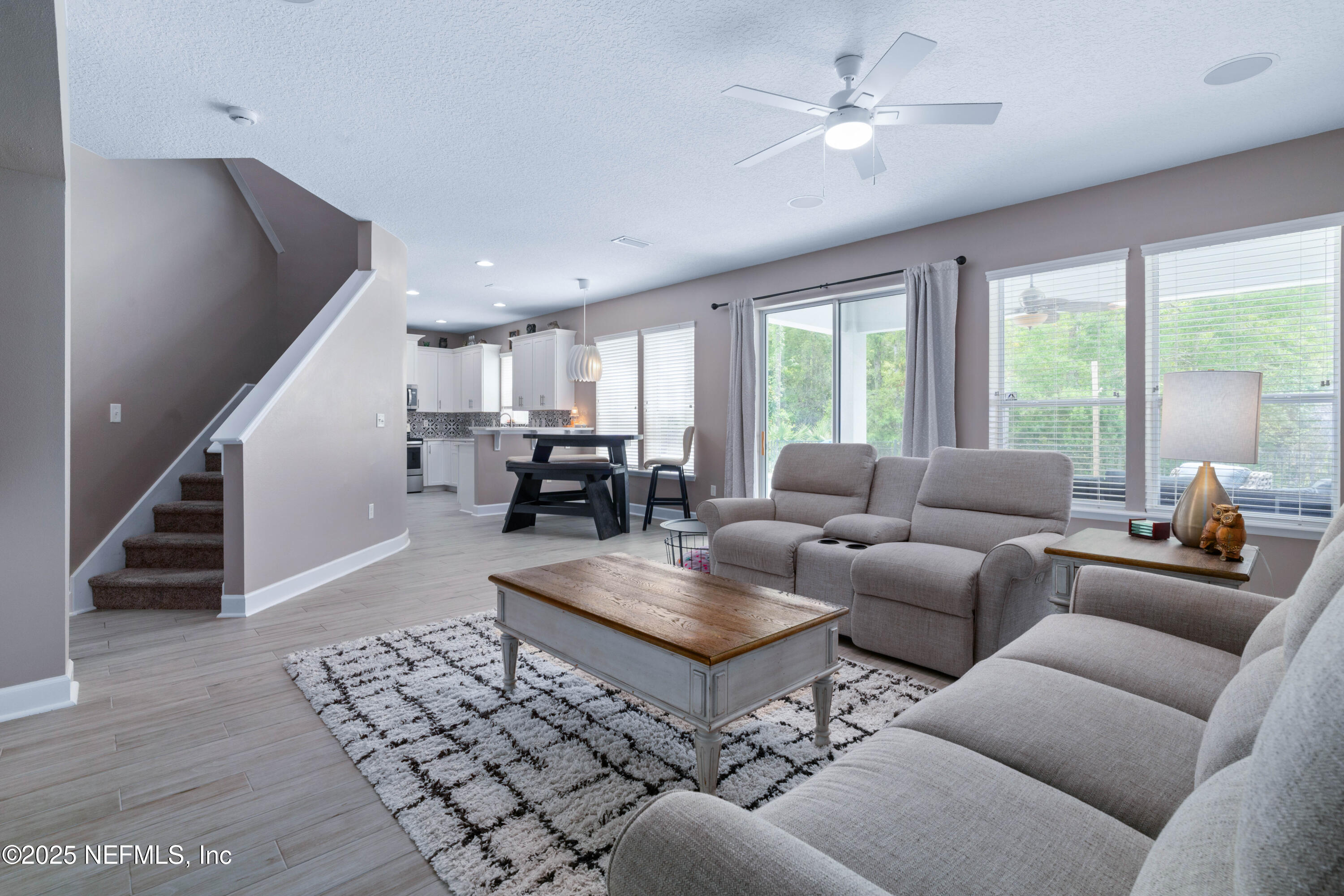 201 North Saxxon Road St. Augustine, FL 32092 - Photo 5 of 42 a living room with furniture and a chandelier