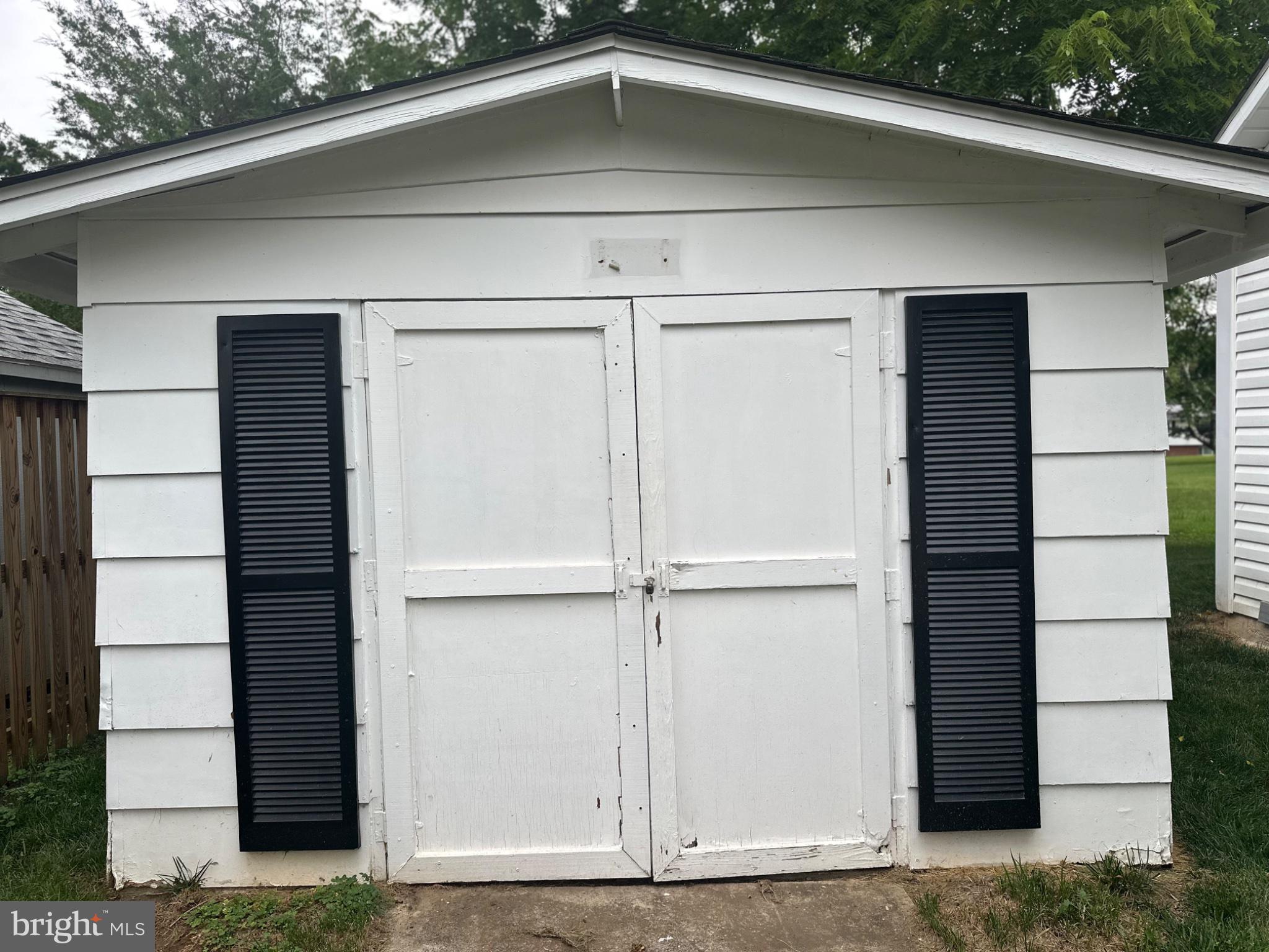 14616 Sturtevant Road Silver Spring, MD 20905 - Photo 42 of 44 Charming white shed with black shutters.