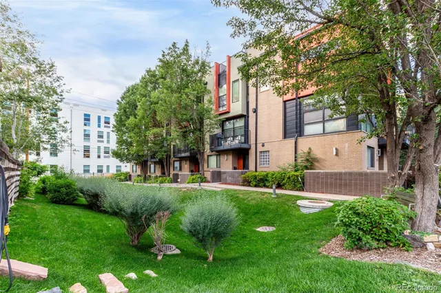 a view of a building with a yard