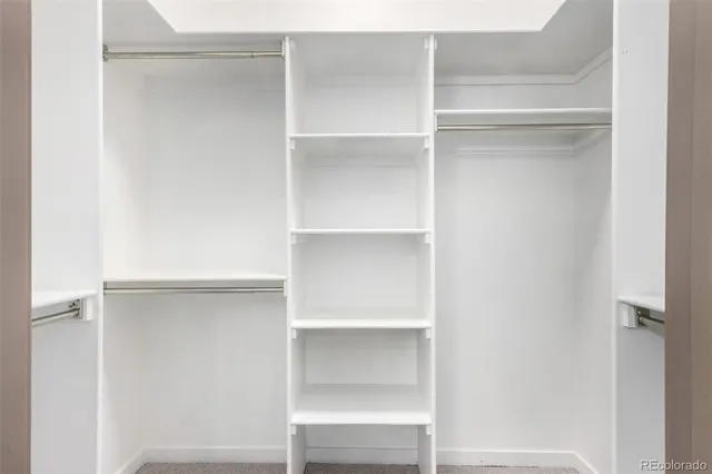 a view of an empty walk in closet