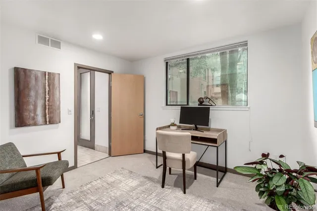 a workspace with furniture and a window