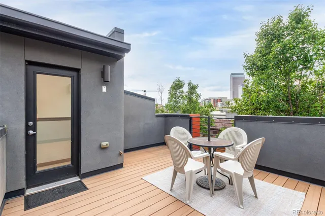 a patio with table and chairs