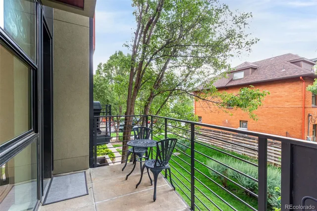 a view of a balcony with chairs