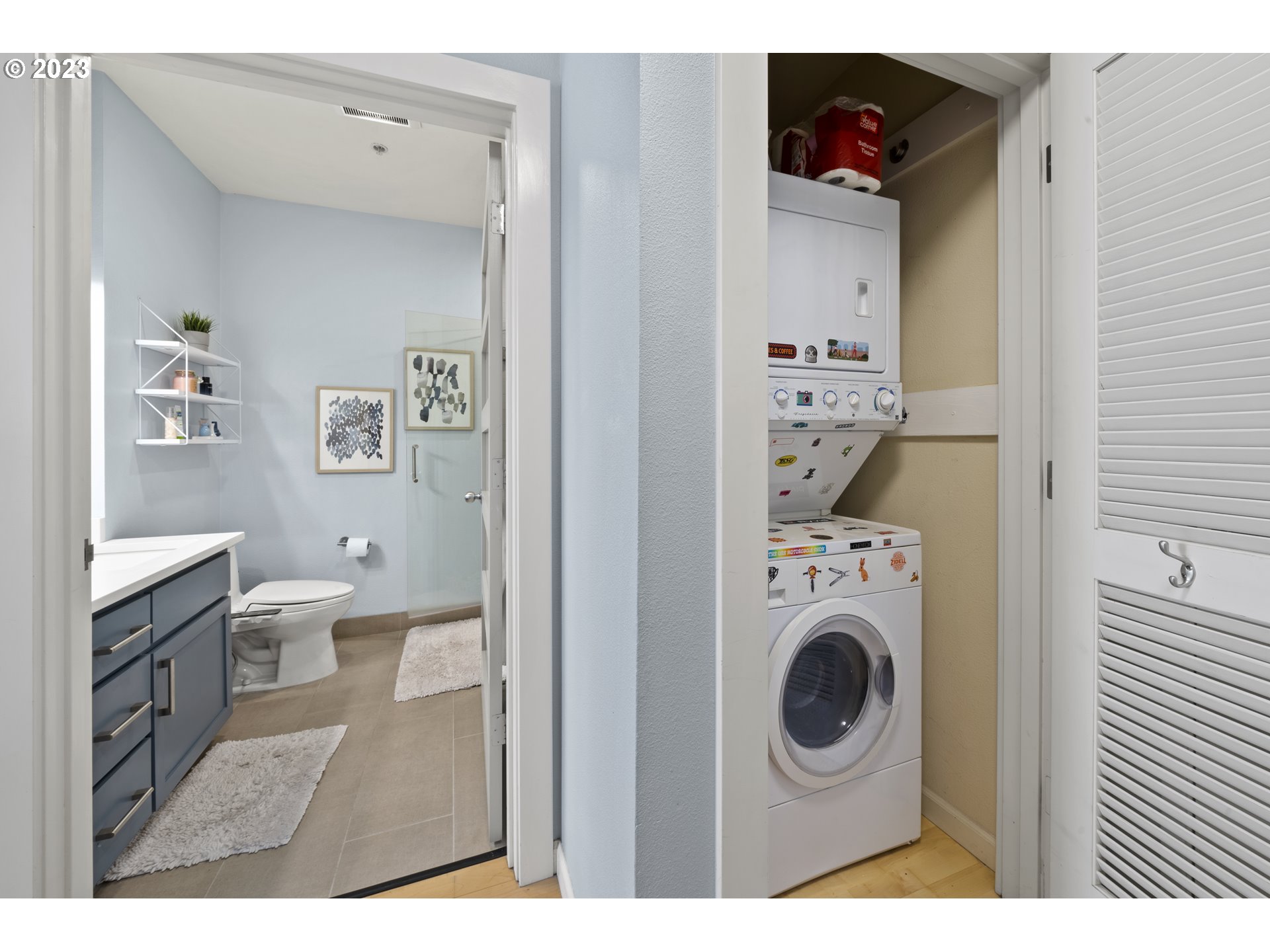 1134 Southwest Jefferson Street, Unit 405 Portland, OR 97201 - Photo 16 of 28 a view of a bedroom with washer and dryer