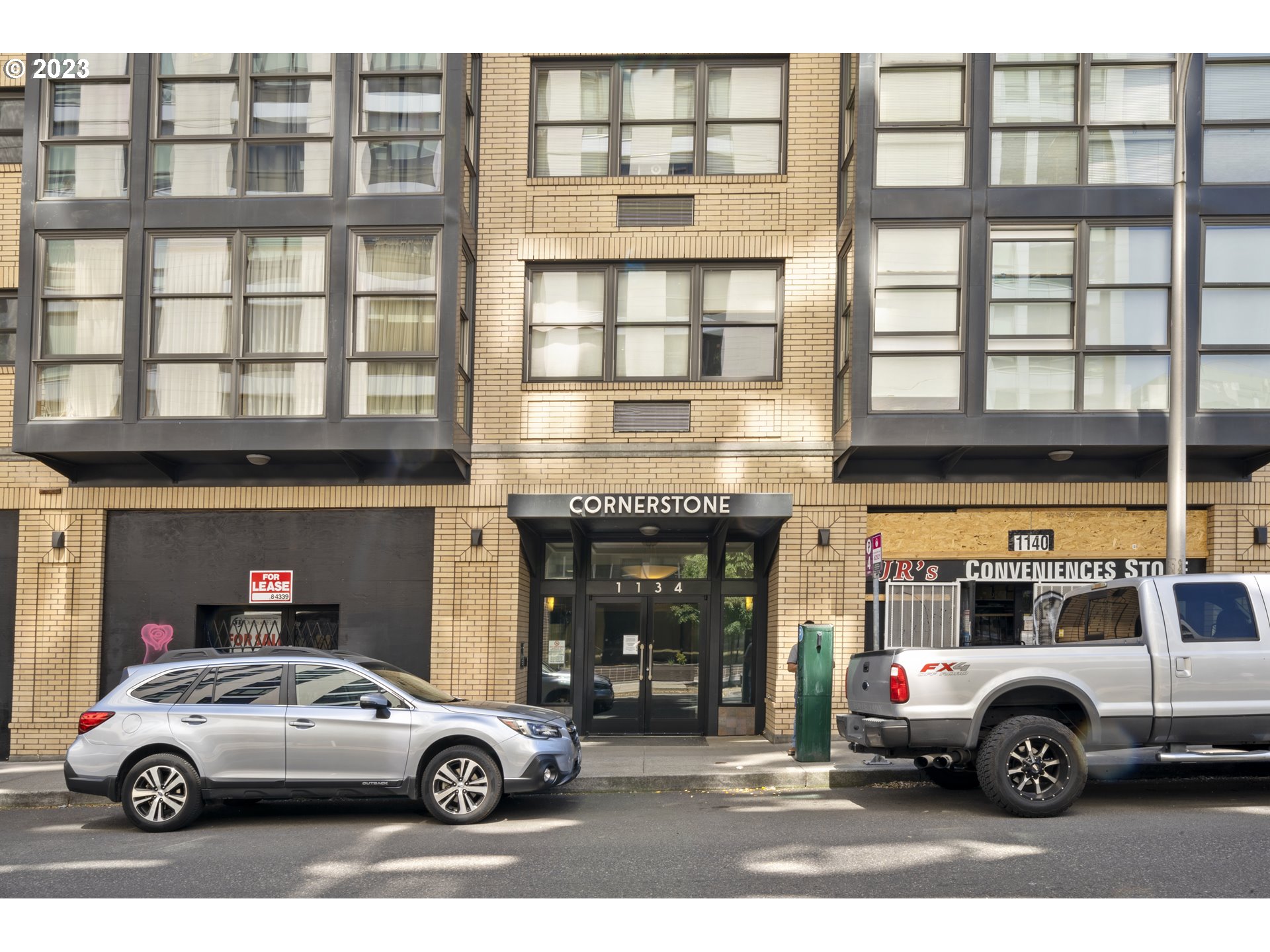 1134 Southwest Jefferson Street, Unit 405 Portland, OR 97201 - Photo 23 of 28 a car parked in front of a building