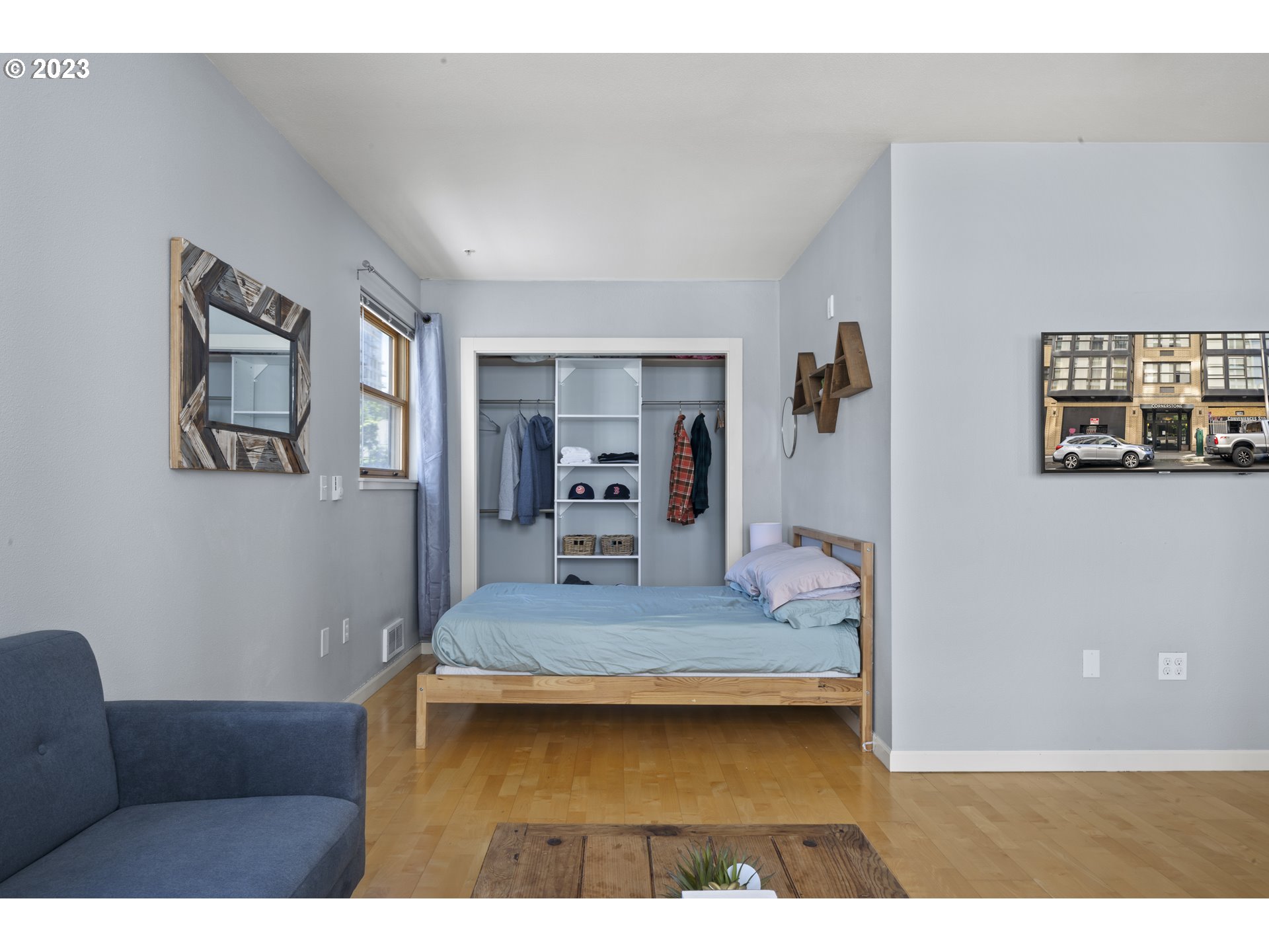 1134 Southwest Jefferson Street, Unit 405 Portland, OR 97201 - Photo 10 of 28 a living room with furniture and a wooden floor