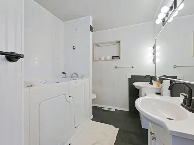 a view of an empty room with stairs