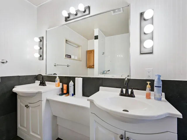 a view of empty room with windows and tub