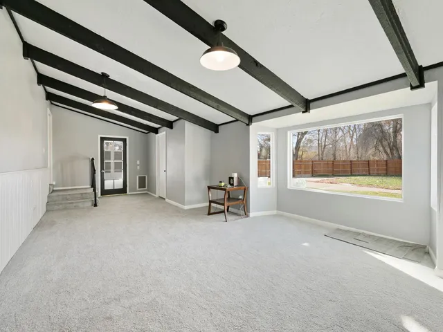 a view of house with outdoor space and swimming pool